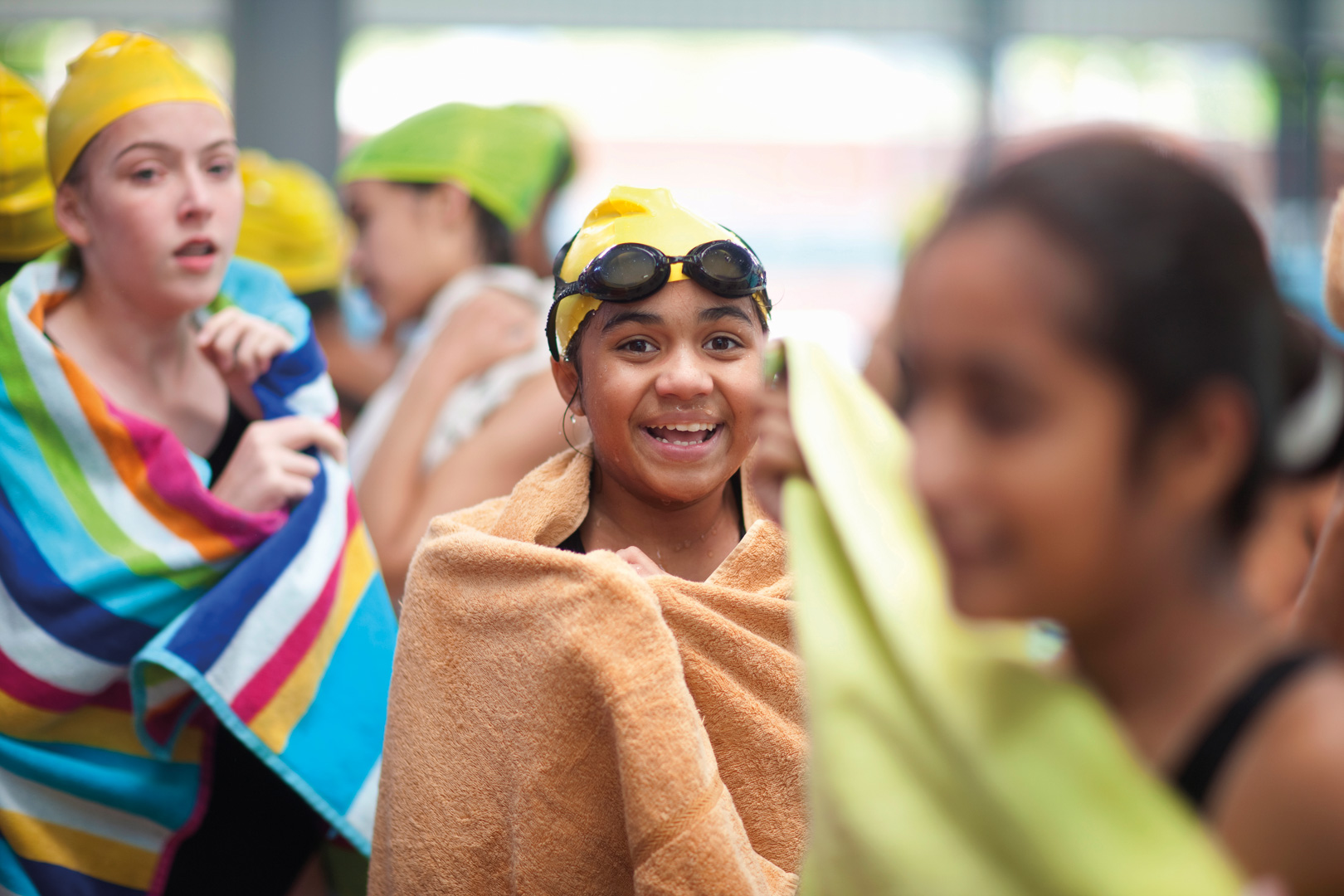 Child in swimming cap and goggles