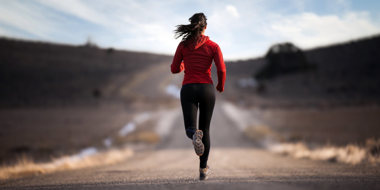 Woman running on a road